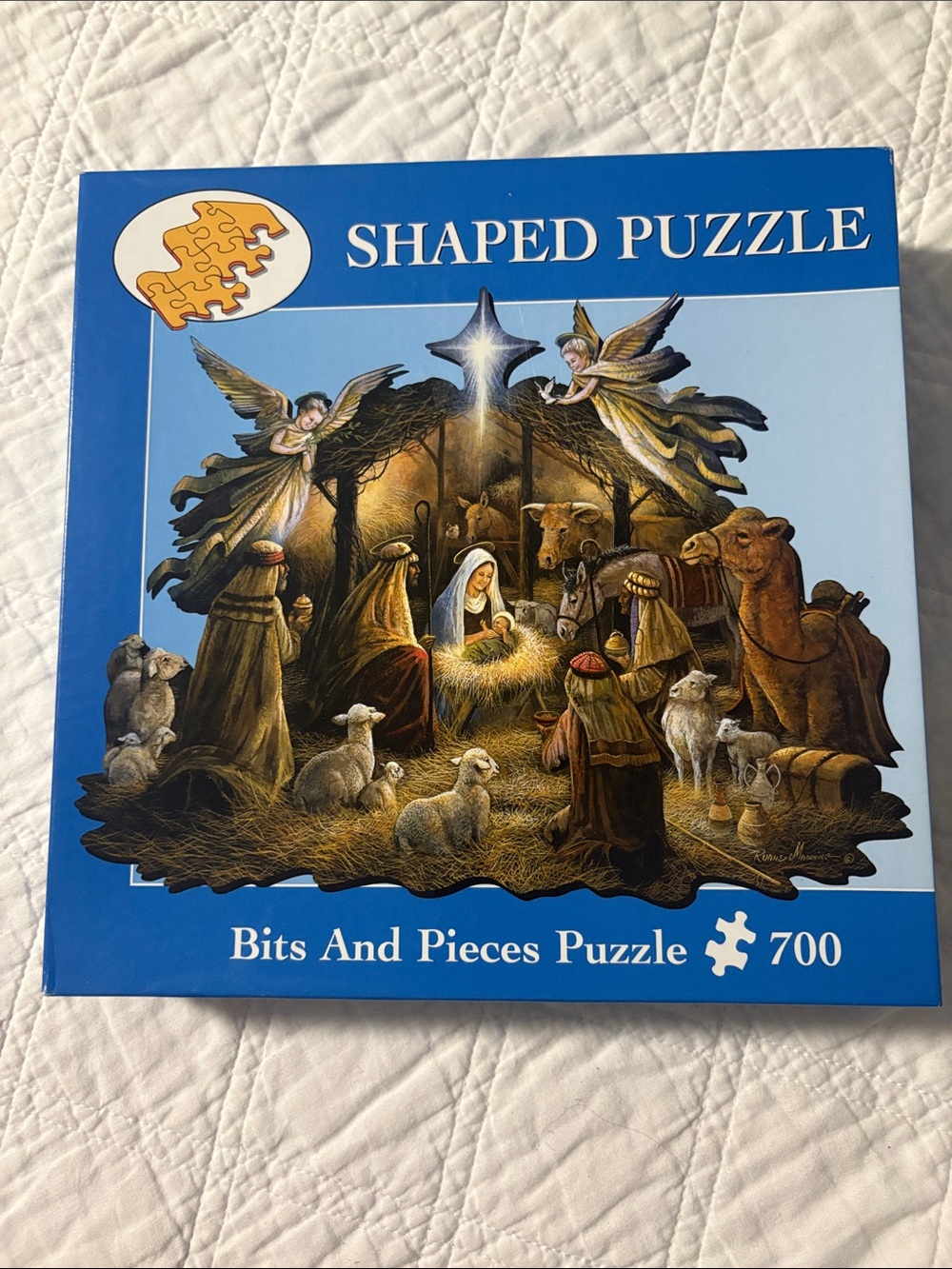 In the manger shaped puzzle by Bits and Pieces 700 pieces